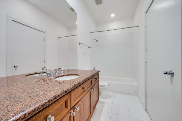 bathroom with tile patterned floors, vanity, and toilet