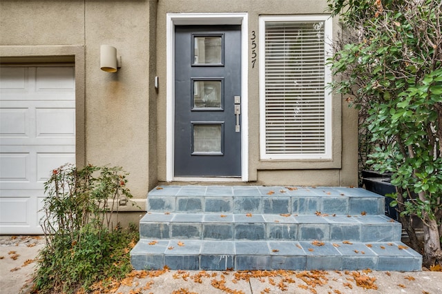 entrance to property featuring a garage