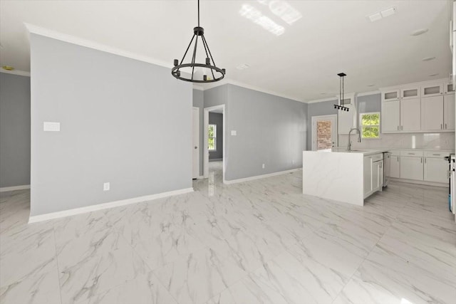 1012 Joe Bailey, Royse City, TX 75189 - kitchen featuring baseboards, ornamental molding, a chandelier, white cabinetry, and open floor plan