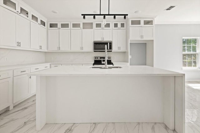 1012 Joe Bailey, Royse City, TX 75189 - kitchen with stainless steel appliances, a sink, light marble finish floors, a center island with sink, and light countertops