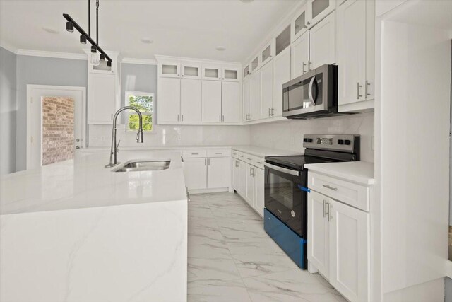 1012 Joe Bailey, Royse City, TX 75189 - kitchen with electric stove, a sink, stainless steel microwave, light marble finish flooring, and crown molding