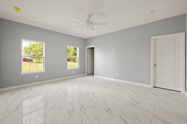 1012 Joe Bailey, Royse City, TX 75189 - empty room featuring baseboards, ceiling fan, and light marble finish flooring