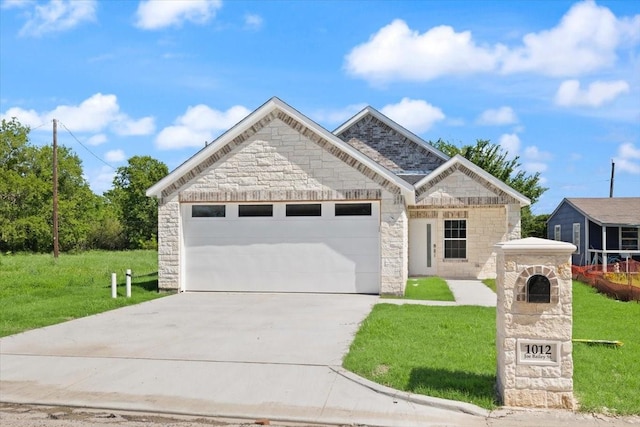 1012 Joe Bailey, Royse City, TX 75189 - french provincial home featuring stone siding, concrete driveway, an attached garage, and a front yard