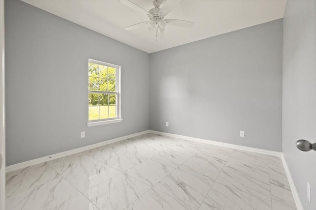 1012 Joe Bailey, Royse City, TX 75189 - empty room featuring marble look tile flooring, a ceiling fan, and baseboards
