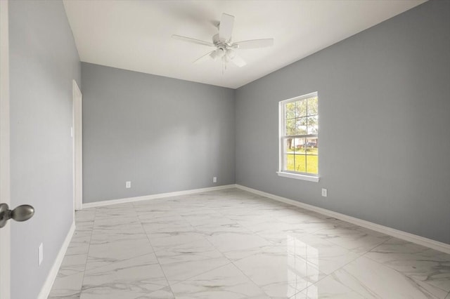 1012 Joe Bailey, Royse City, TX 75189 - unfurnished room with light marble finish floors, ceiling fan, and baseboards