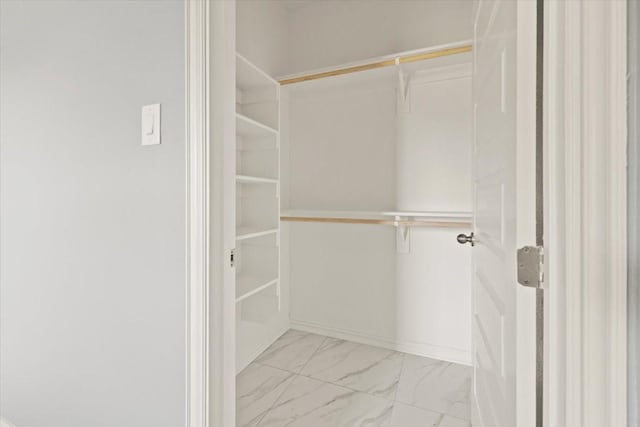 1012 Joe Bailey, Royse City, TX 75189 - walk in closet featuring light marble finish floors