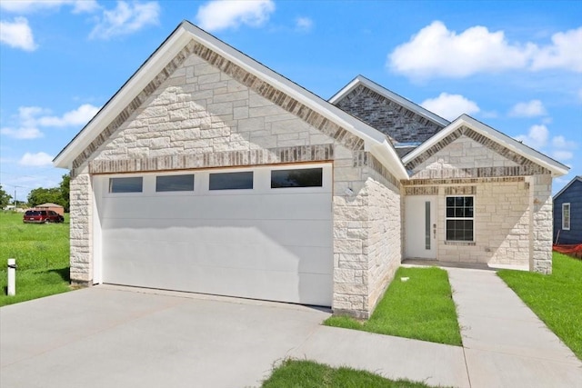 1012 Joe Bailey, Royse City, TX 75189 - french country style house featuring stone siding, concrete driveway, an attached garage, and a front lawn