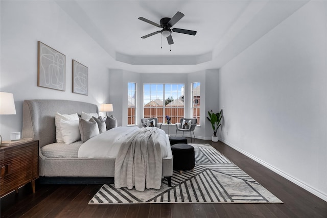 bedroom featuring ceiling fan and dark wood-type flooring