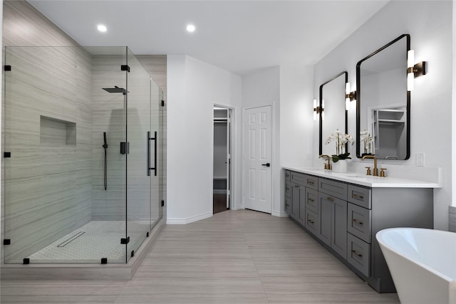 bathroom with vanity and plus walk in shower