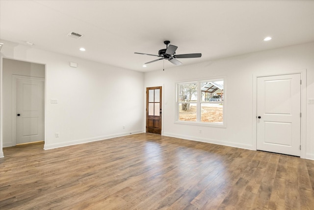 unfurnished room featuring ceiling fan and light wood-type flooring