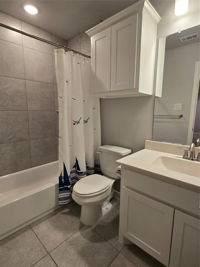 full bathroom with vanity, shower / tub combo, tile patterned floors, and toilet