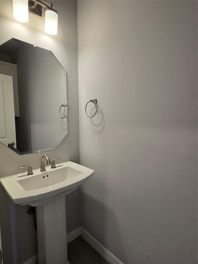 bathroom featuring sink and wood-type flooring