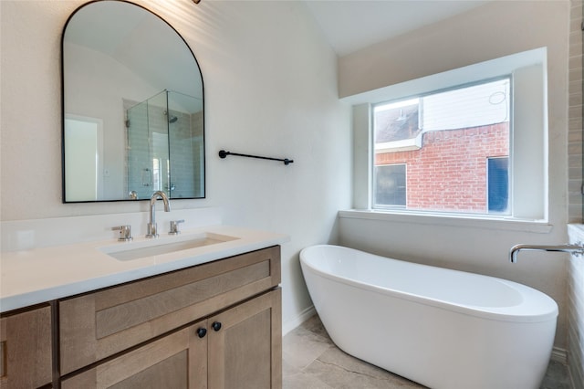 bathroom with vanity and separate shower and tub