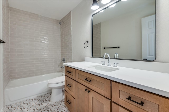 full bathroom with vanity, toilet, and tiled shower / bath