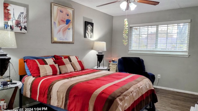 bedroom featuring wood-type flooring and ceiling fan