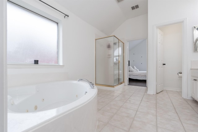 bathroom with vaulted ceiling, independent shower and bath, and a healthy amount of sunlight