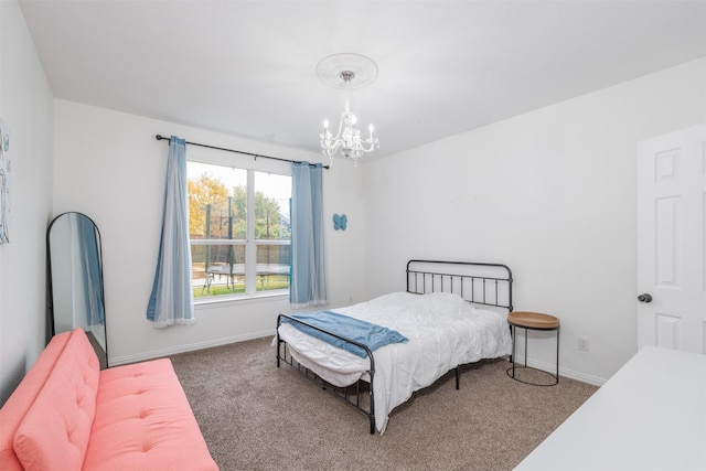 bedroom with carpet flooring and a notable chandelier