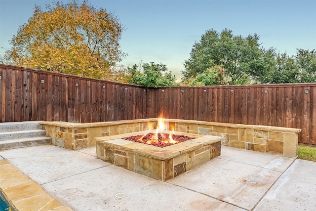 view of patio / terrace with an outdoor fire pit