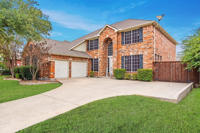 view of front of house with a garage and a front lawn