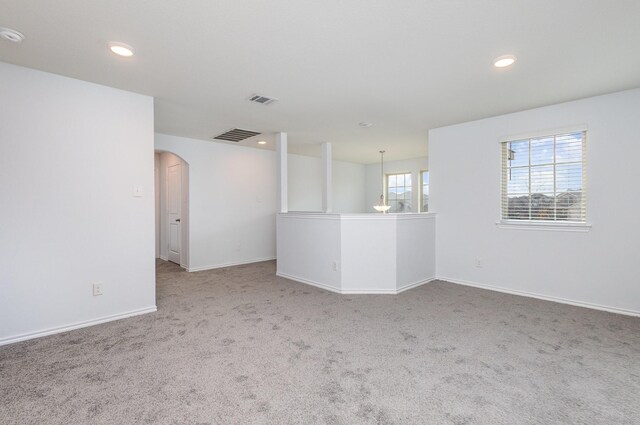 unfurnished room featuring carpet