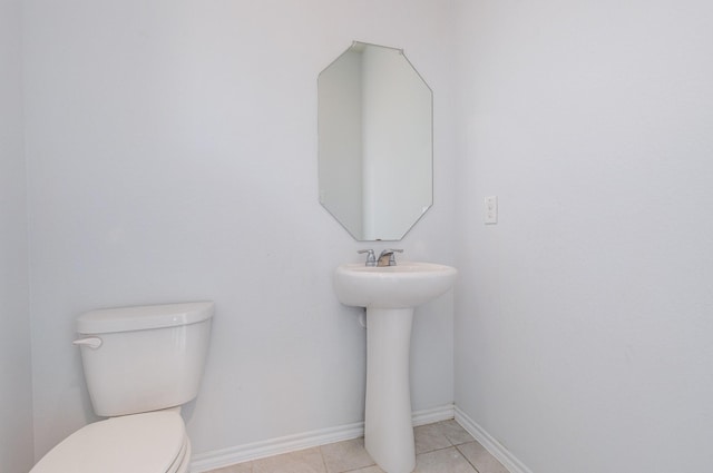 bathroom featuring tile patterned floors and toilet