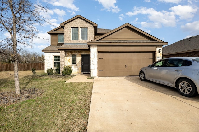 view of front of house with a garage and a front lawn