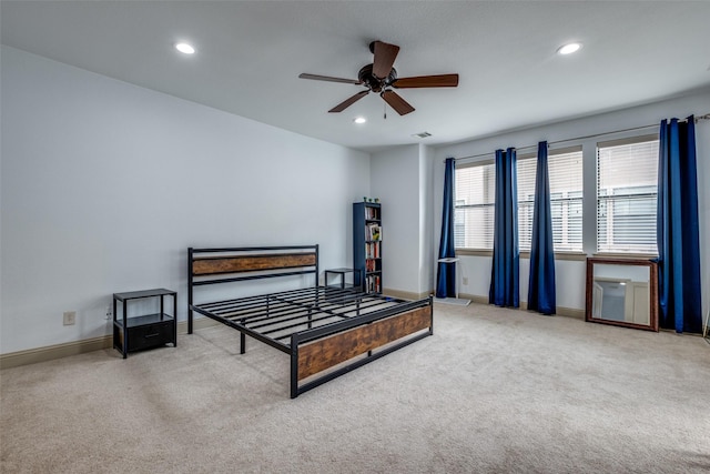 carpeted bedroom featuring ceiling fan