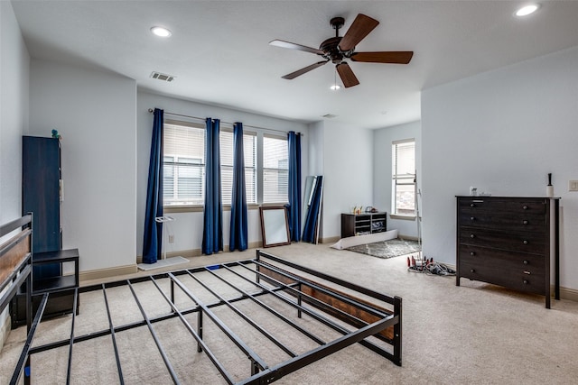 carpeted bedroom with ceiling fan