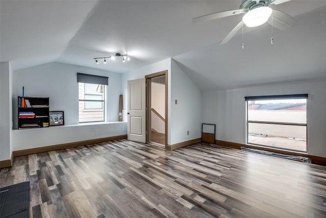 additional living space with ceiling fan, hardwood / wood-style floors, and lofted ceiling