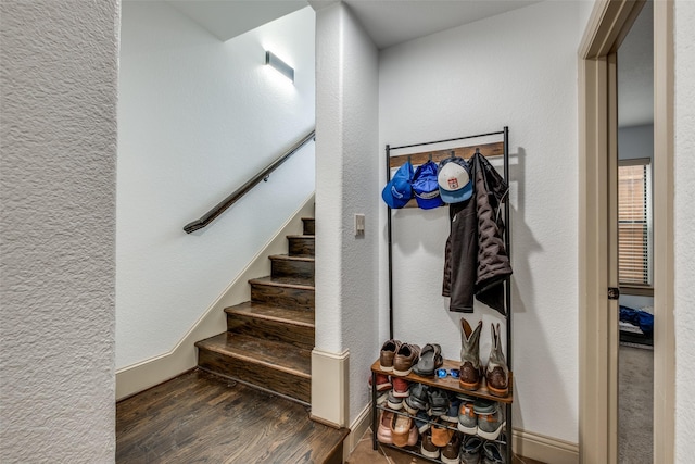 staircase featuring hardwood / wood-style flooring