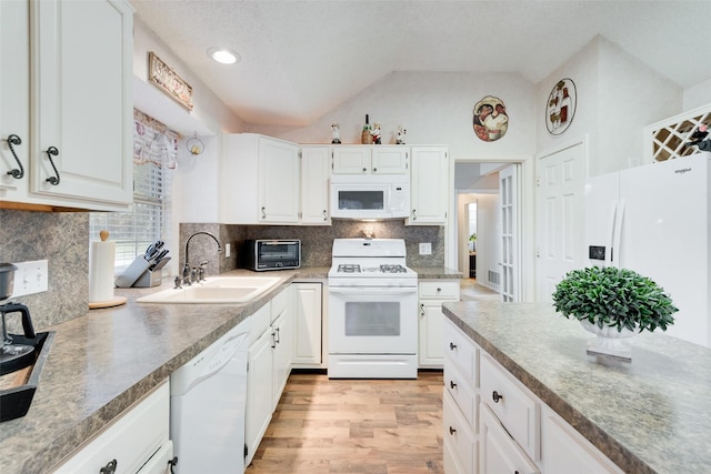 kitchen featuring white cabinetry, sink, light hardwood / wood-style floors, lofted ceiling, and white appliances