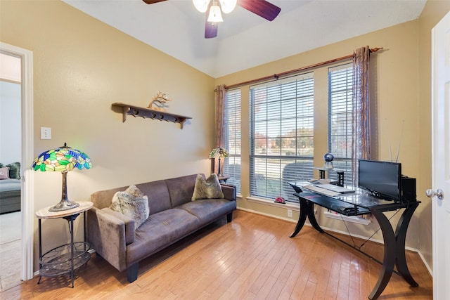 home office featuring hardwood / wood-style floors and ceiling fan