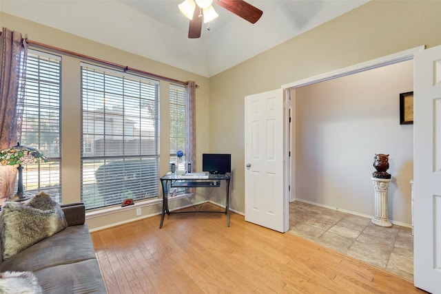 office area featuring wood-type flooring, vaulted ceiling, and ceiling fan