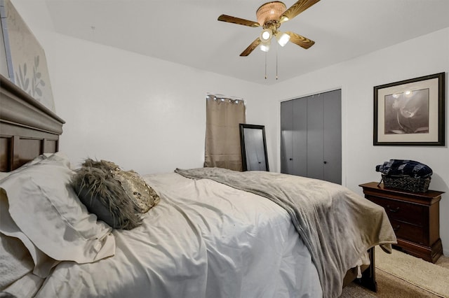 bedroom featuring ceiling fan and carpet floors