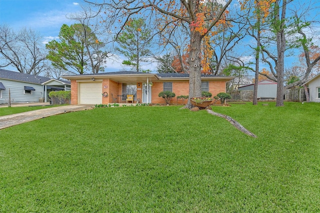 ranch-style house with a garage, a front lawn, and covered porch