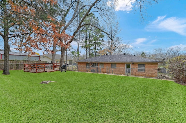 view of yard with a deck