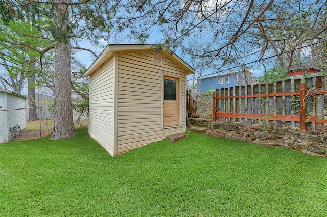 view of outbuilding featuring a yard