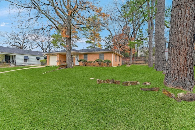 view of front of property with a front lawn and a garage