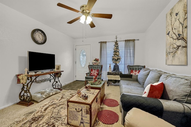 carpeted living room featuring ceiling fan