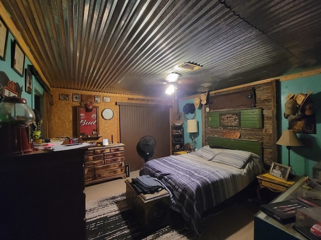 bedroom with ceiling fan and concrete floors