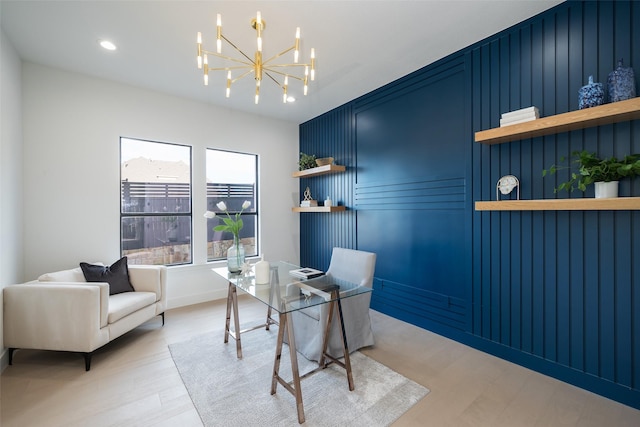 office area with a chandelier and light hardwood / wood-style flooring