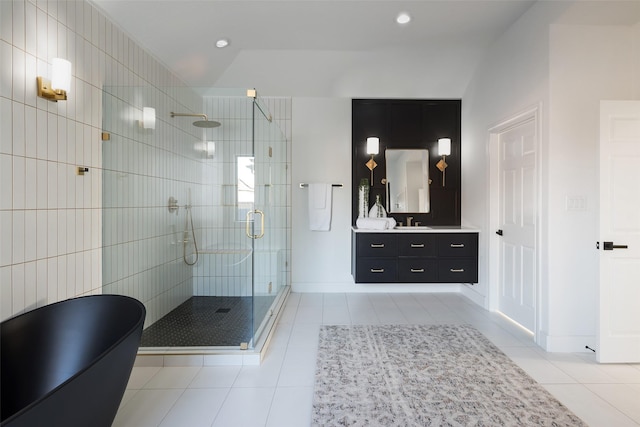 bathroom with vanity, tile patterned floors, and walk in shower