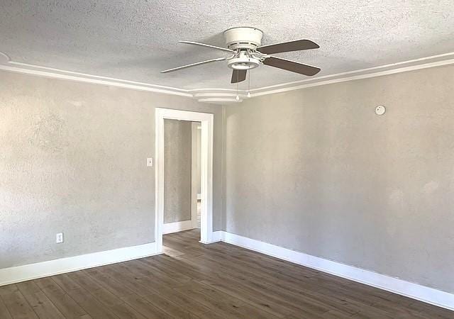 unfurnished room featuring ornamental molding, a textured ceiling, ceiling fan, and dark wood-type flooring