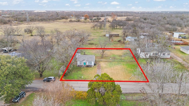 birds eye view of property featuring a rural view