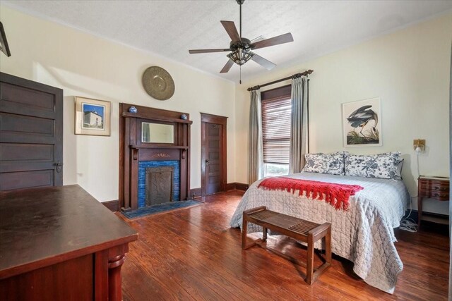 bedroom featuring ceiling fan and dark hardwood / wood-style flooring