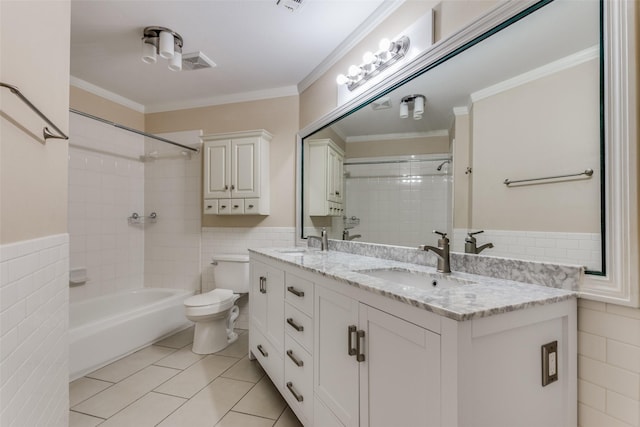 full bathroom featuring crown molding, vanity, tile walls, and toilet