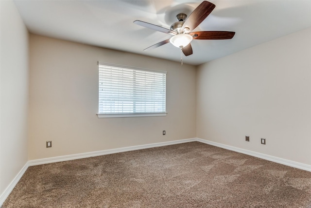 spare room with carpet and ceiling fan