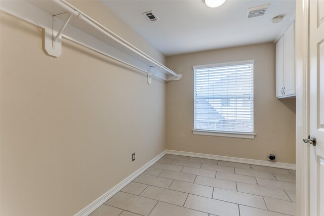 spacious closet featuring light tile patterned floors