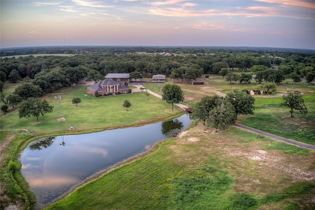 aerial view at dusk with a water view