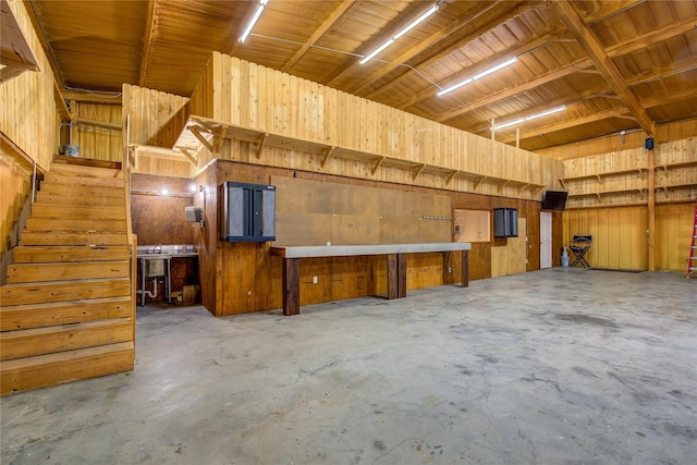 garage featuring wooden walls